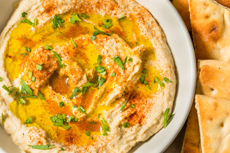 Homemade Creamy Mediterranea Chickpea Hummus with Olive Oil and Paprika
