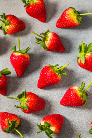 Organic Raw Red Long Stem Strawberries in a Bunchの写真素材