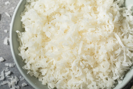 Sweetened Coconut Shreds with Sugar in a Bowlの写真素材