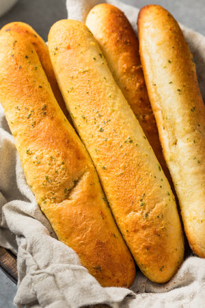 Homemade Italian Soft Garlic Breadsticks with Butter and Salt
