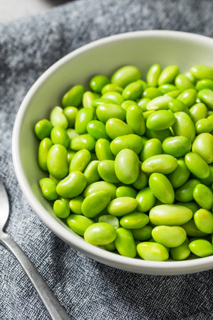 Green Organic Shelled Soy Edamame Beans in a Bowl Ready to Eatの写真素材