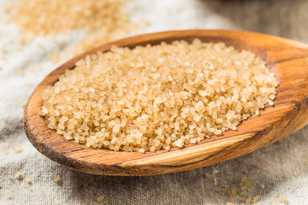 Raw Cane Turbinado Sugar in a Spoonの写真素材