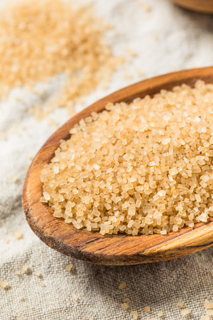 Raw Cane Turbinado Sugar in a Spoonの写真素材