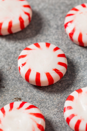 Sweet Red and White Peppermint Candy in a Round Shapeの写真素材