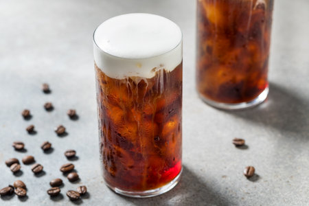 Refreshing Espresso Coffee with Cold Foam and Ice Cubes