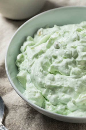 Homemade Sweet Green Fluff Salad with Marshmallows Pineapple and Pistachiosの写真素材