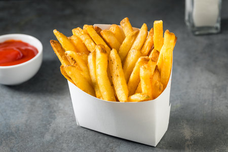 Homemade Fast Food Golden French Fries with Tomato Ketchup