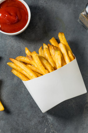 Homemade Fast Food Golden French Fries with Tomato Ketchup