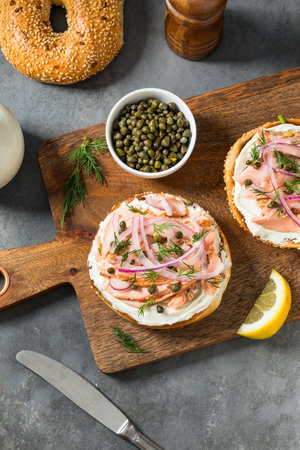 Healthy Homemade Salmon Lox Everything Bagel with Onion and Capersの写真素材