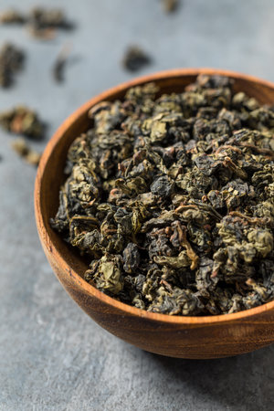 Organic Raw Dry Asian Oolong Tea in a Bowl to Steep