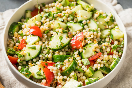 Healthy Homemade Mediterranean Couscous Salad with Cucumber and Tomatoの写真素材