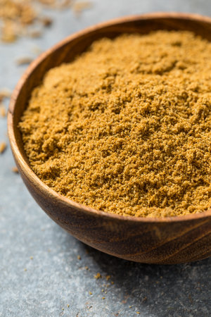 Brown Raw Organic Cumin Seed Spice in a Bowlの写真素材