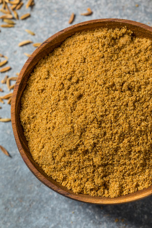 Brown Raw Organic Cumin Seed Spice in a Bowlの写真素材
