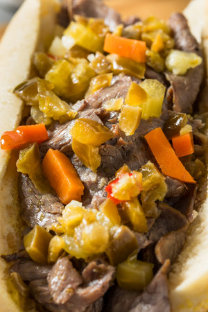 Homemade Chicago Italian Beef Sandwich with Giardiniera Peppers and Friesの写真素材