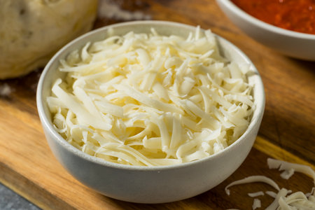 Homemade Shredded Mozzarella Cheese in a Bowl for Pizzaの写真素材
