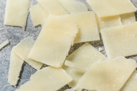 Healthy Hard Shaved Parmesan Cheese in a Bowl for Cooking