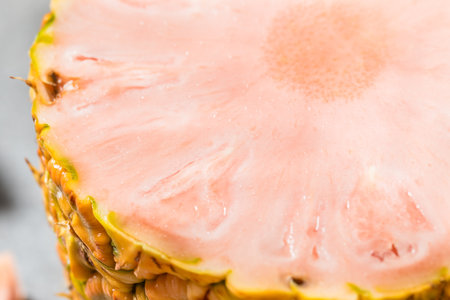 Organic Raw Pink Pineapple Cut into Slices to Eat