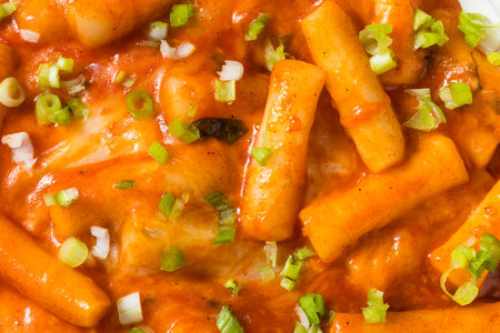 Homemade Cheesy Korean Tteokbokki with Green Scallions