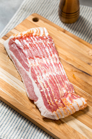 Organic Grass Fed Raw Bacon Strips Ready to Cookの写真素材