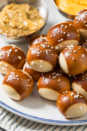 Salty Homemade Soft Pretzel Bites with Mustard and Cheeseの写真素材