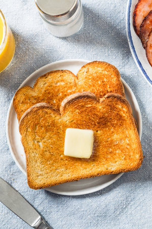 Homemade Buttered Toast for Breakfast with Orange Juiceの写真素材