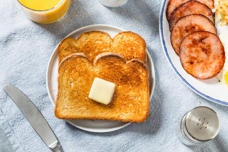 Homemade Buttered Toast for Breakfast with Orange Juiceの写真素材