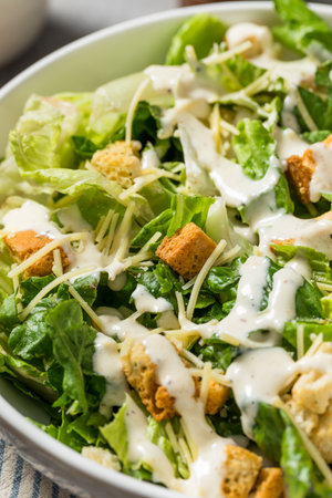 Healthy Homemade Caesar Salad with Cheese Dressing and Croutonsの写真素材