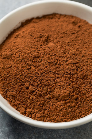 Organic Raw Dry Cocoa Powder in a Bowl