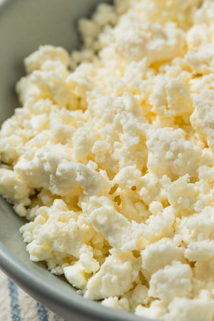 Organic Raw Greek Crumbled Feta Cheese in a Bowlの写真素材