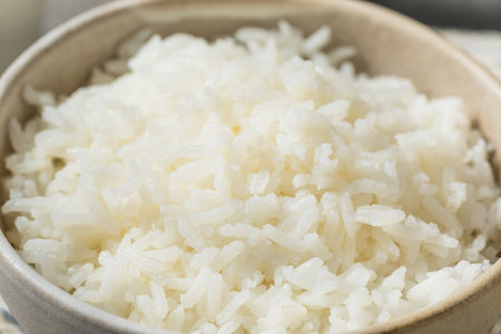 Organic Cooked Short Grain White Rice in a Bowl with Chipsticksの写真素材