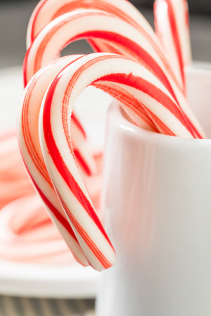 Sweet Red and White Christmas Peppermint Candycanes Ready to Eatの写真素材