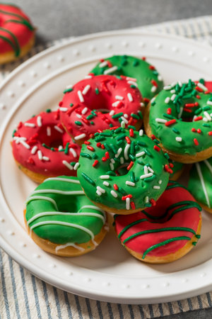 Sweet Homemade Donuts with Red Green and Sprinklesの写真素材