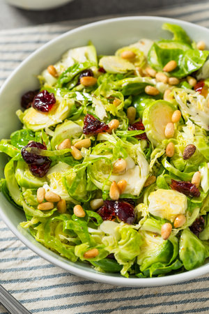 Healthy Fall Shaved Brussel Sprout Salad with Pine Nutsの写真素材