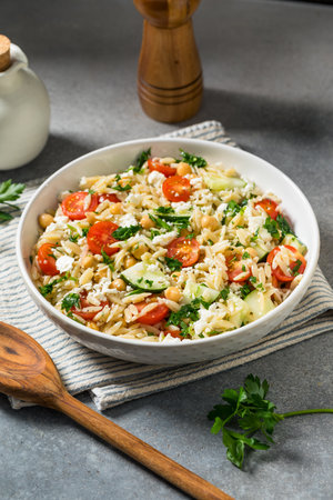 Healthy Greek Orzo Pasta Salad with Feta Tomato and Cucumberの写真素材