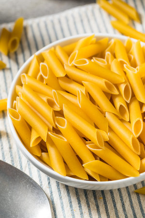 Organic Raw Dry Mostaccioli Pasta Ready to Cook in a Bowl