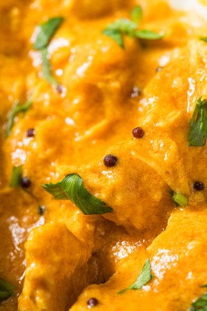 Homemade Indian Coconut Mango Curry Chicken with Rice and Naan Breadの写真素材