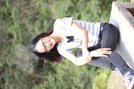 Portrait of a beautiful Asian woman relaxing in the park, Thailand.