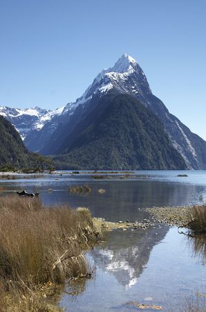 Mitre peak, New-Zealand at Milford Sound with a reflection in the lake.の写真素材