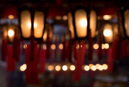 Abstract blurry red Chinese lanterns in Man Mo Temple in Hong Kong with bokehの写真素材