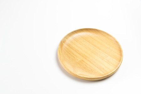 Wooden plate or tray isolated on white backgroundの写真素材