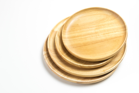 Wooden plates or trays isolated on white backgroundの写真素材