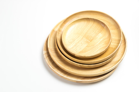 Wooden plates or trays isolated on white backgroundの写真素材
