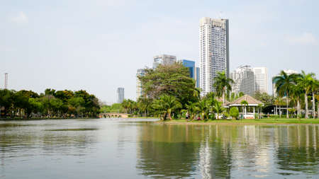 BANGKOK, THAILAND - MARCH 8, 2017: A large pool with beautiful sky in the Jatujak park that is the place for people to relax in Bangkok in the afternoonのeditorial素材