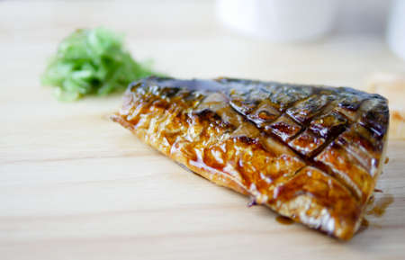 Close up of  grilled Saba is on the wood table in the kitchenの写真素材