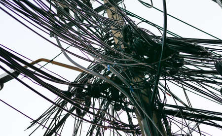 Messy electrical and telecommunication wire in Bankgkok, Thailandの写真素材