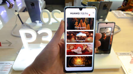 BANGKOK, THAILAND - MAY 11, 2019: Hands on Huawei P30 Pro that show welcome and features screen of...