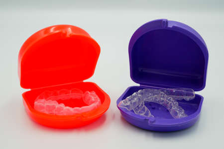 Clear plastic retainer teeth in the boxset, it's a new technology equipment for orthodontist give the patient to orthodontic surgery in dental clinic or hospitalの写真素材