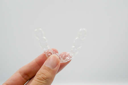 Clear plastic retainer teeth, it's a new technology equipment for orthodontist give the patient to...