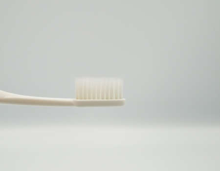 toothbrush on white background, it's representing for daily dental careの写真素材