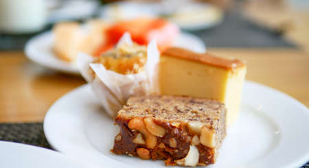 Delicious banana cake with Cashew nuts and other type of cakes for morning that placed on table.